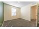 Bedroom with neutral colors and a large window for natural light at 546 Foothill Cove Ln, Henderson, NV 89002