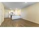 Open floor plan with a bright kitchen featuring modern appliances, white cabinetry, and a breakfast bar at 546 Foothill Cove Ln, Henderson, NV 89002