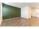 Living room featuring durable laminate flooring, fresh paint, open layout, and great natural light at 546 Foothill Cove Ln, Henderson, NV 89002