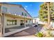 Backyard featuring a covered patio, desert landscaping and bright blue sky at 6086 Shadow Oak Dr, North Las Vegas, NV 89031