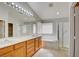 Bathroom featuring a double vanity, shower, and bathtub at 6086 Shadow Oak Dr, North Las Vegas, NV 89031