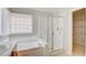 Bathroom featuring a shower, bathtub, and built-in shelving at 6086 Shadow Oak Dr, North Las Vegas, NV 89031