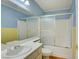 Well-lit bathroom featuring a shower-tub combo, with a large vanity sink and counter at 6086 Shadow Oak Dr, North Las Vegas, NV 89031