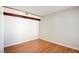 Cozy bedroom with neutral walls and wood floors at 6086 Shadow Oak Dr, North Las Vegas, NV 89031