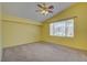 Sunny bedroom with a vaulted ceiling, ceiling fan and a large window for natural light at 6086 Shadow Oak Dr, North Las Vegas, NV 89031