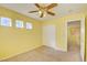 Bedroom with carpet, double door closet and three windows for natural light at 6086 Shadow Oak Dr, North Las Vegas, NV 89031