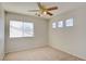 Bright bedroom with a ceiling fan, neutral paint, and windows providing natural light at 6086 Shadow Oak Dr, North Las Vegas, NV 89031