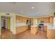 Well-lit kitchen with wood cabinets, stainless steel appliances, and wood floors at 6086 Shadow Oak Dr, North Las Vegas, NV 89031