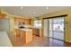 Bright kitchen featuring wood cabinets, stainless steel appliances, and a view to the patio at 6086 Shadow Oak Dr, North Las Vegas, NV 89031