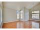 Bright living room with wood floors and large windows at 6086 Shadow Oak Dr, North Las Vegas, NV 89031