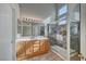 Bathroom features double sinks, oak vanity, and a large shower at 6425 Mountain Mesa Ave, Las Vegas, NV 89156