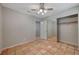 Bright bedroom with mirrored closet doors and tile floors at 6425 Mountain Mesa Ave, Las Vegas, NV 89156