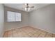 Simple bedroom with tile floors and window coverings at 6425 Mountain Mesa Ave, Las Vegas, NV 89156