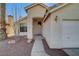 Front entry of the house with a security door and walkway at 6425 Mountain Mesa Ave, Las Vegas, NV 89156