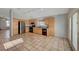 Bright kitchen with oak cabinets, tile floor, and stainless steel appliances at 6425 Mountain Mesa Ave, Las Vegas, NV 89156