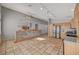 Kitchen features a breakfast bar with stone veneer and tile flooring at 6425 Mountain Mesa Ave, Las Vegas, NV 89156