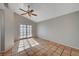 Spacious living room with tile floors and sliding glass doors at 6425 Mountain Mesa Ave, Las Vegas, NV 89156