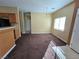 Open dining room area with carpet, chandelier, and natural light at 6448 Elwood Mead Ave # 103, Las Vegas, NV 89156