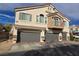 This home has multiple garage spaces and an exterior balcony at 6448 Elwood Mead Ave # 103, Las Vegas, NV 89156