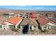 An aerial view showcases a charming single-story home with a landscaped front yard in a well-planned neighborhood at 6544 Sandero Springs St, Las Vegas, NV 89166