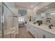 Bathroom featuring double sinks, quartz countertops, and a glass shower enclosure at 6544 Sandero Springs St, Las Vegas, NV 89166