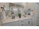 Bathroom featuring double sinks, quartz countertops, and modern finishes at 6544 Sandero Springs St, Las Vegas, NV 89166