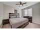 This is a stylish bedroom featuring a rustic decor with a large window at 6544 Sandero Springs St, Las Vegas, NV 89166