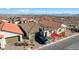 A single-story home showcasing its desert landscaping and driveway leading to an attached two-car garage at 6544 Sandero Springs St, Las Vegas, NV 89166