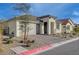 Inviting single-story home featuring a brick driveway, low-maintenance desert landscaping, and attached garage at 6544 Sandero Springs St, Las Vegas, NV 89166