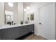 This newly remodeled bathroom features double sinks, modern fixtures, and an open concept vanity at 6961 Emerald Springs Ln, Las Vegas, NV 89113