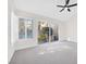 Primary bedroom featuring a ceiling fan, an attached dressing room, and lots of natural light at 6961 Emerald Springs Ln, Las Vegas, NV 89113