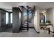 Stylish bathroom with a spiral staircase, glass-enclosed shower, and modern vanity at 709 Dragon Peak Dr, Henderson, NV 89012