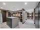 Expansive walk-in closet with custom shelving, an island dresser, and ample storage at 709 Dragon Peak Dr, Henderson, NV 89012