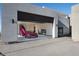 Spacious garage with an exotic car, automatic doors, and modern architectural design at 709 Dragon Peak Dr, Henderson, NV 89012