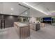 Contemporary kitchen featuring stainless steel appliances, marble countertops, and an open floor plan at 709 Dragon Peak Dr, Henderson, NV 89012