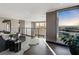 Modern living room with city views, stylish seating, and sleek design at 709 Dragon Peak Dr, Henderson, NV 89012