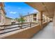 Exterior view from a balcony with community buildings and garages visible under a clear sky at 7135 S Durango Dr # 209, Las Vegas, NV 89113