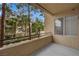 Cozy balcony view overlooking lush greenery and nearby buildings on a sunny day at 7135 S Durango Dr # 209, Las Vegas, NV 89113