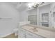 Bright bathroom with vanity, mirror and a shower-tub combination at 7135 S Durango Dr # 209, Las Vegas, NV 89113