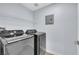 This laundry room features modern Samsung washer and dryer units and shelving at 7135 S Durango Dr # 209, Las Vegas, NV 89113