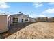 View of the empty backyard with a shed on the left at 720 Sam Jonas Dr, Las Vegas, NV 89145