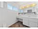 Bathroom featuring a single vanity, a mirror, and built in cabinets at 720 Sam Jonas Dr, Las Vegas, NV 89145