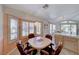 Kitchen nook with a round table and four leather chairs at 7232 Vista Bonita Dr, Las Vegas, NV 89149