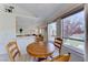 Bright dining area with a round table and chairs near a kitchen at 7232 Vista Bonita Dr, Las Vegas, NV 89149