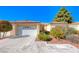 Single-story house with a garage and well-manicured landscaping at 7232 Vista Bonita Dr, Las Vegas, NV 89149