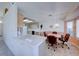 Well-equipped kitchen with light wood cabinets and tile countertops at 7232 Vista Bonita Dr, Las Vegas, NV 89149