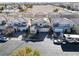 Aerial view of property featuring a well-manicured lawn and a driveway at 7321 Aspire Ct, Las Vegas, NV 89113