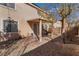 A quaint backyard features a covered patio and a low maintenance desert landscape at 7321 Aspire Ct, Las Vegas, NV 89113