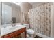 Well-maintained bathroom featuring a shower-tub combo, single sink vanity, and neutral color scheme at 7321 Aspire Ct, Las Vegas, NV 89113