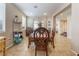 Bright dining room with wooden table and chairs, neutral walls, and bright natural light at 7321 Aspire Ct, Las Vegas, NV 89113